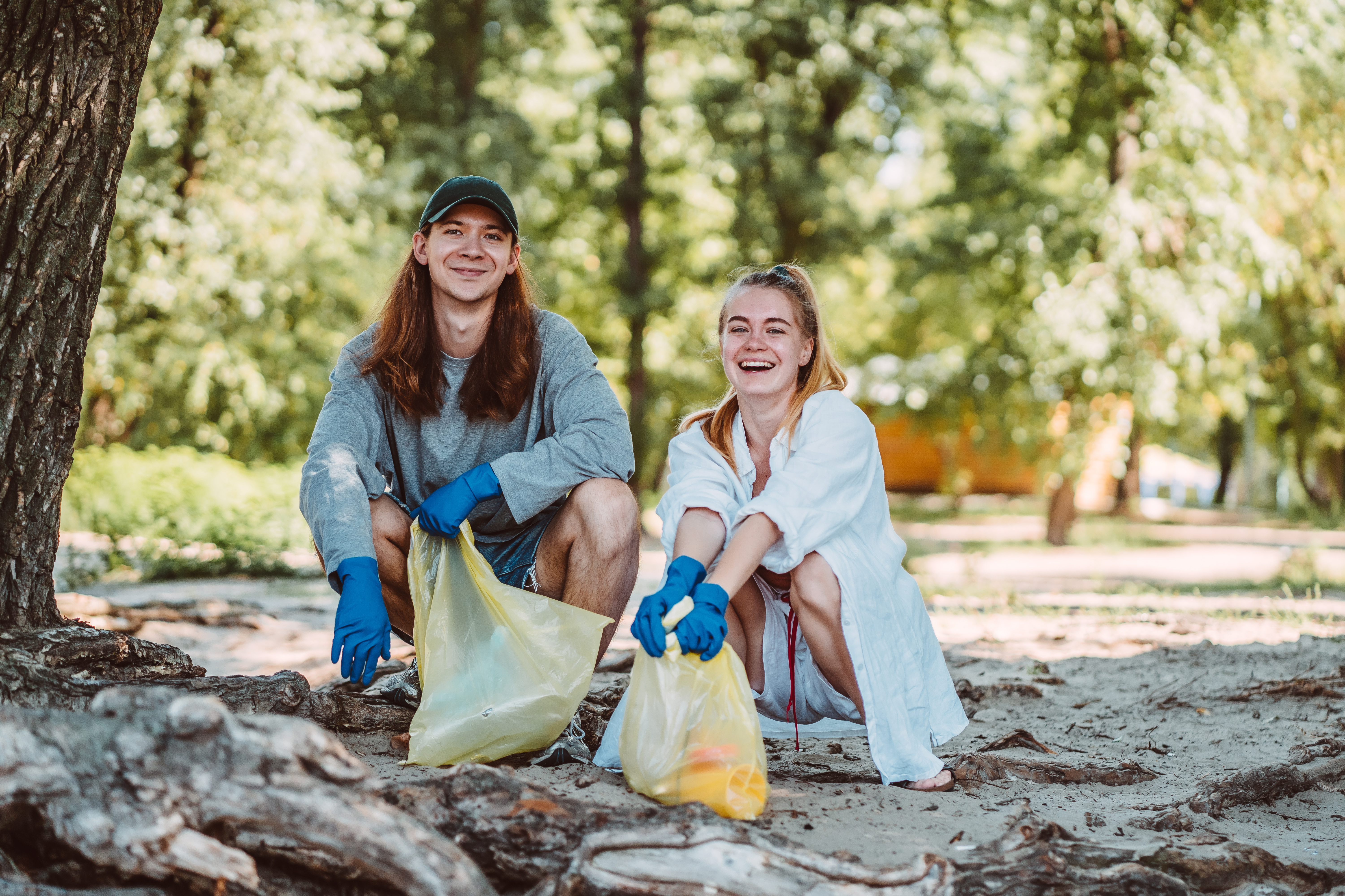 people on a beach litter picking